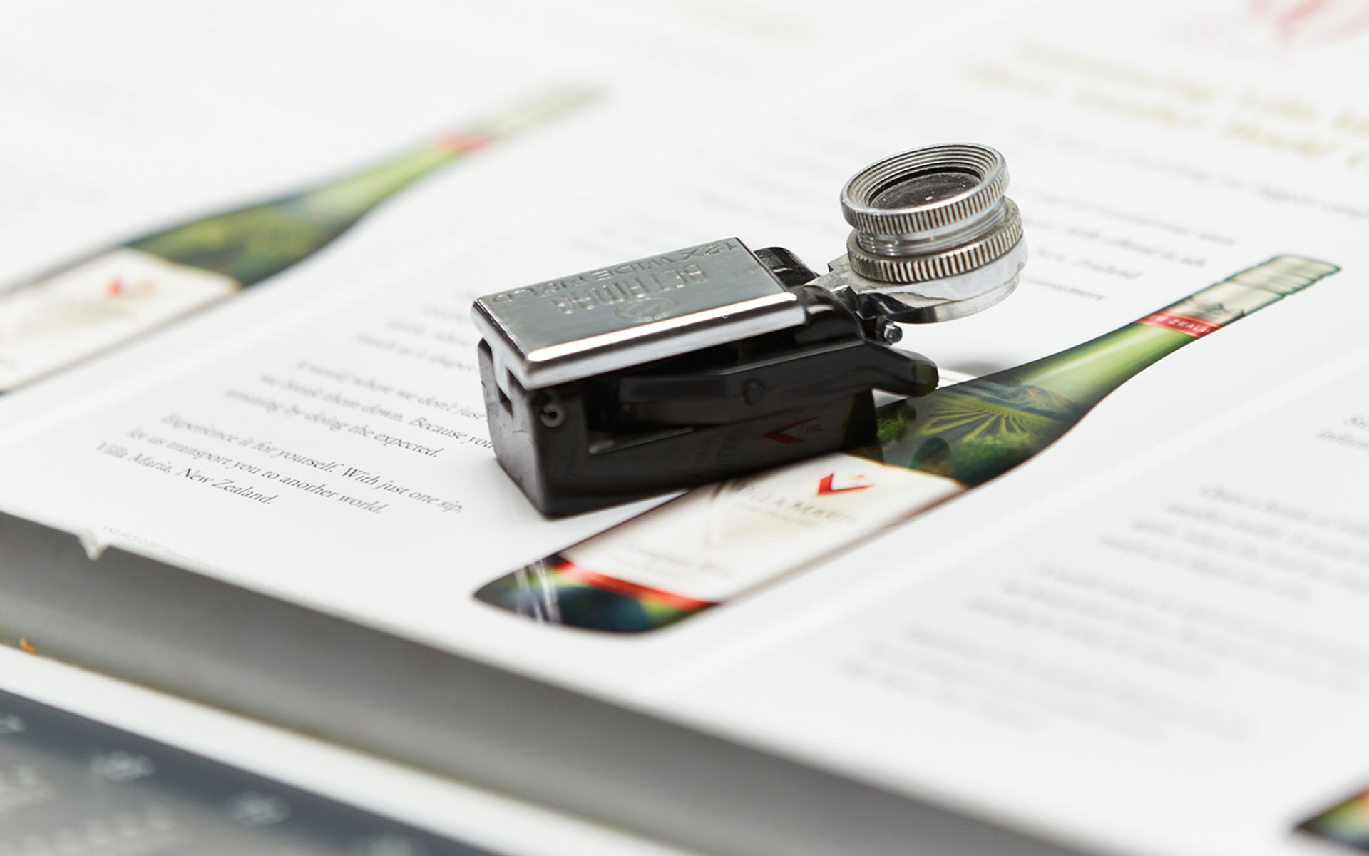 A photo of a loop, looking at the stochastic screening on a printed piece.