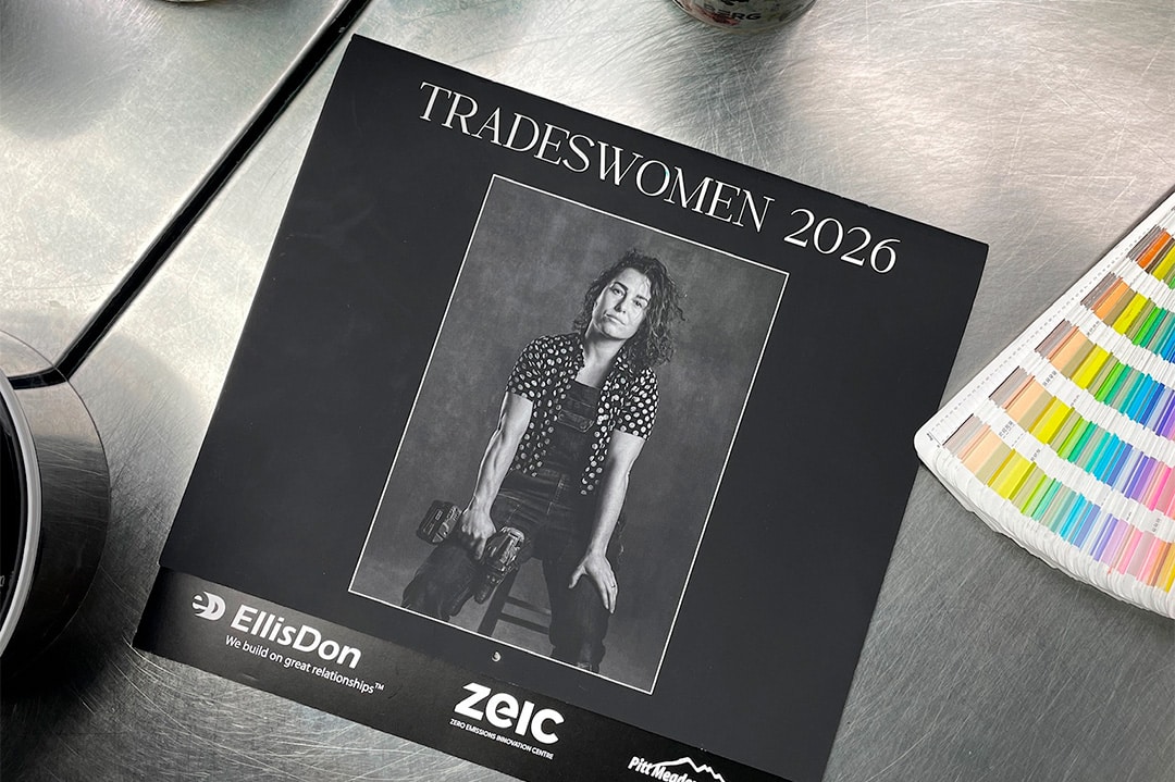 The cover of the 2026 Tradeswomen Calendar on an industrial surface