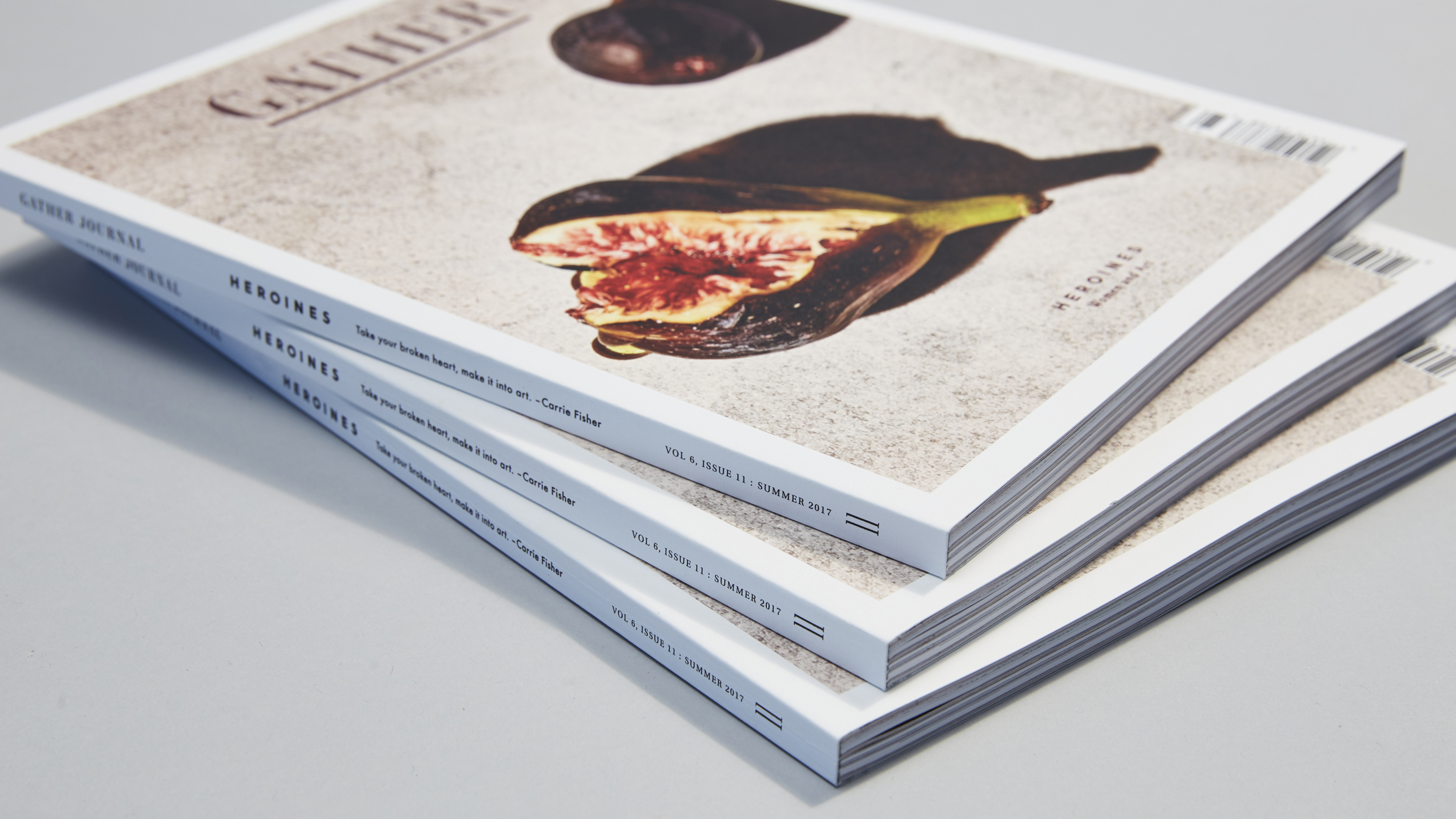 Display of three perfect bound books fanned out.